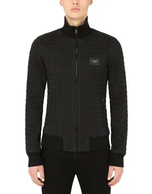 Quilted nylon jacket with branded plate